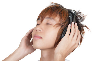 Image showing Portrait of Korean teenager enjoying music