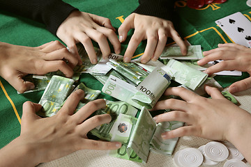 Image showing Greedy hands grabbing cash