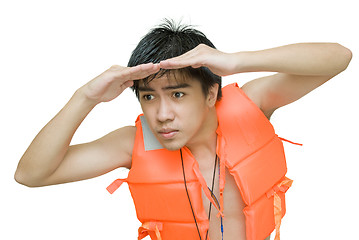 Image showing Lifeguard peering worried