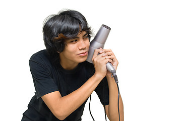 Image showing Teenager attacking w hair drier