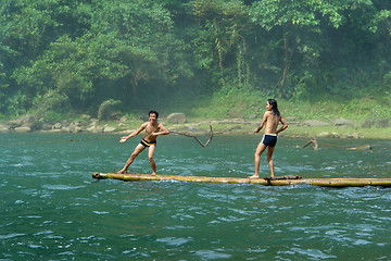 Image showing Boys playing on tropical raft