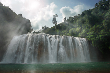 Image showing Gloomy jungle waterfall