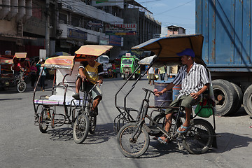 Image showing Southeast-Asian tricycles on urban street