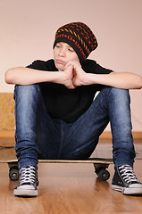 Image showing The teenager with a skateboard 