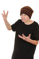 Image showing The teenager in a black vest and a hat