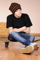 Image showing The teenager with a skateboard 