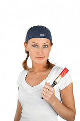 Image showing Beautiful girl on white holding paint brush with red paint