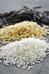 Image showing Three piles of rice