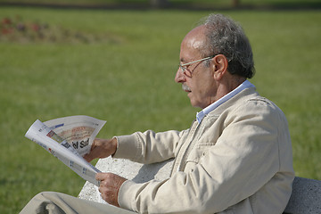 Image showing Man reading newspaper