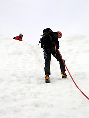 Image showing Mountaineer rappelling