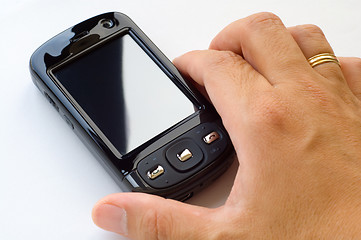 Image showing Holding pda and stylus