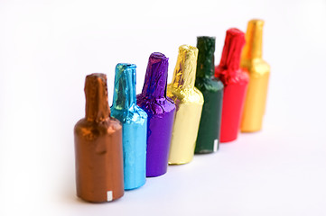 Image showing Colorful chocolate bottles