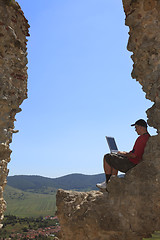 Image showing Working on a laptop