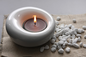 Image showing candles and massage stones in a calm zen spa