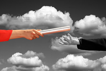 Image showing hands passing the baton