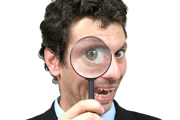 Image showing businessman with magnifying glass