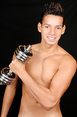 Image showing Young man with dumbbell