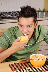 Image showing Young man having breakfast