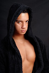 Image showing Young man with black bathrobe