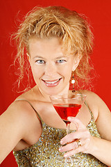 Image showing Blond woman with red drink