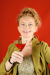 Image showing Blond woman with red drink