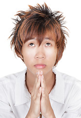 Image showing Praying Korean teen portrait