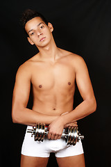 Image showing Young man with dumbbell