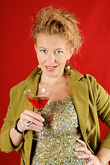 Image showing Beautiful blond woman with red drink