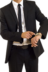 Image showing businessman looking at his watch