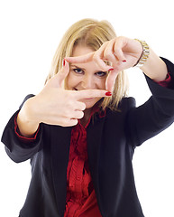 Image showing A woman looking through her fingers