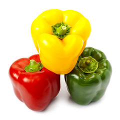 Image showing Three sweet peppers in yellow, red and green