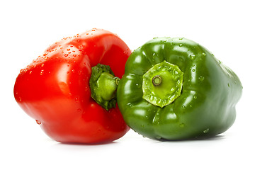 Image showing red and green peppers with water drops on