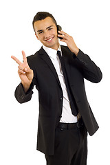 Image showing businessman on the phone making his victory sign