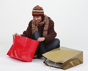 Image showing Young woman searching for gifts