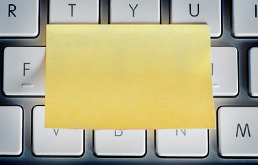 Image showing Sticky note on laptop keyboard