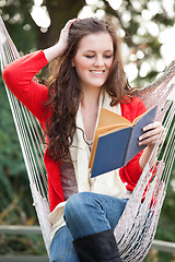 Image showing Teenager reading a book