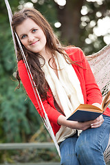 Image showing Teenager reading a book