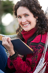 Image showing Mature woman reading a book