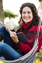 Image showing Mature woman reading a book