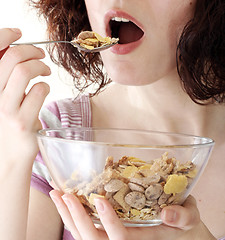 Image showing Young people eating milk with cereals