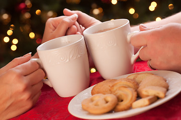 Image showing Man and Woman Sharing Hot Chocolate and Cookies