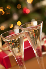 Image showing Sparkling Champagne Flutes and Gifts