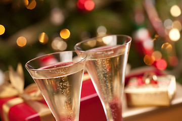 Image showing Sparkling Champagne Flutes and Gifts