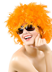 Image showing woman wearing an orange feather wig and sunglasses