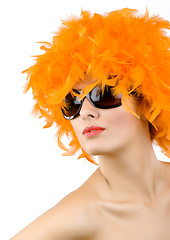 Image showing woman with orange feather wig and sunglasses