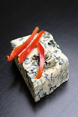 Image showing Red pepper slices on cheese