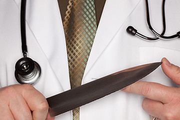 Image showing Doctor with Stethoscope Holding A Large Knife