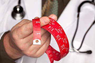 Image showing Doctor with Stethoscope Holding Measuring Tape