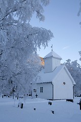 Image showing White chapel with cemetery