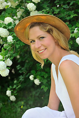 Image showing Young woman resting in garden